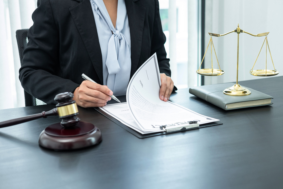 Female lawyer working with legal case document contract